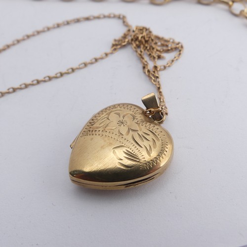 410 - A 9ct yellow gold heart shaped Pendant Locket, the front with foliate decoration, 18mm wide, on 9ct ... 