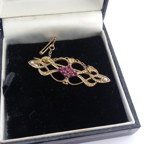 411 - A 9ct gold Art Nouveau Pendant, set two red facetted pastes, 4cm long, on 9ct gold trace chain toget... 