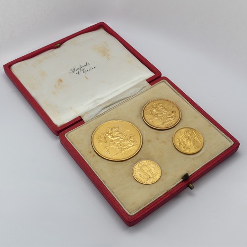 497 - A cased set of four 1887 gold Coins, comprising five pounds (£5), two pounds (£2), sovereign and hal... 