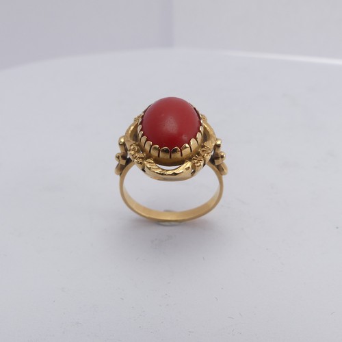 268 - A coral Dress Ring, the oval cabochon stone approx. 14mm long, mounted in 18ct yellow gold, Size N&f... 