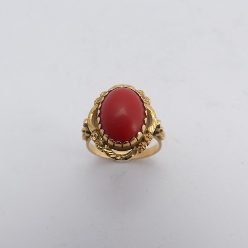 268 - A coral Dress Ring, the oval cabochon stone approx. 14mm long, mounted in 18ct yellow gold, Size N&f... 