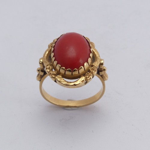 268 - A coral Dress Ring, the oval cabochon stone approx. 14mm long, mounted in 18ct yellow gold, Size N&f... 