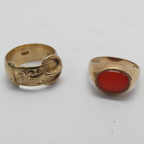 269 - A 9ct yellow gold Buckle Ring, Size K, together with a small carnelian signet ring, mounted in 9ct g... 