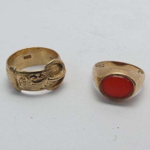 269 - A 9ct yellow gold Buckle Ring, Size K, together with a small carnelian signet ring, mounted in 9ct g... 