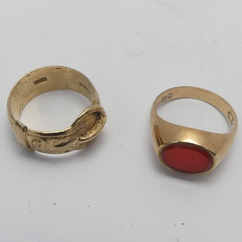 269 - A 9ct yellow gold Buckle Ring, Size K, together with a small carnelian signet ring, mounted in 9ct g... 