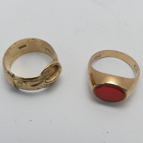 269 - A 9ct yellow gold Buckle Ring, Size K, together with a small carnelian signet ring, mounted in 9ct g... 