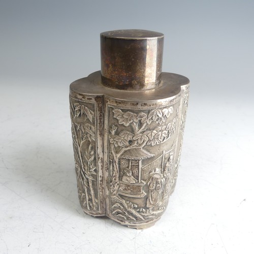 A Chinese export silver Tea Caddy, of lobed oval form with pull off circular cover, one side with figural decoration, the other with scrolling dragon, the two smaller sections with bamboo and foliate depictions, the cover with engraved character mark, marks to base a little unclear but probably for Wang Hing, Hong Kong, 13.5cm high, 8.2ozt.