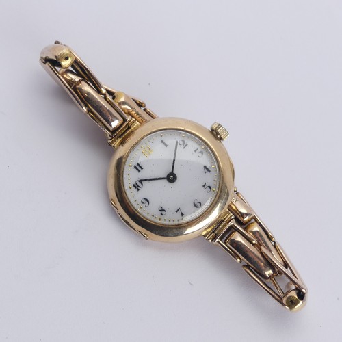 240 - A 9ct gold lady's Wristwatch, white enamel dial with Arabic numerals, Aureole 17-jewels movement, 25... 