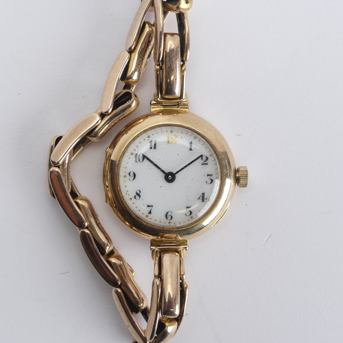 240 - A 9ct gold lady's Wristwatch, white enamel dial with Arabic numerals, Aureole 17-jewels movement, 25... 