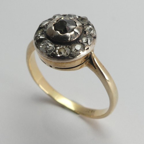 264 - A diamond cluster Ring, the single cut stones in a circular white metal mount with an 18ct yellow go... 