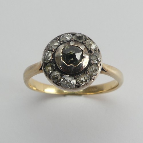 264 - A diamond cluster Ring, the single cut stones in a circular white metal mount with an 18ct yellow go... 