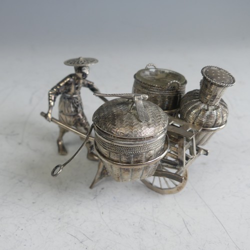 114 - A Chinese novelty silver Cruet, in the form of a richshaw, with mustard, open salt and pepper 'baske... 