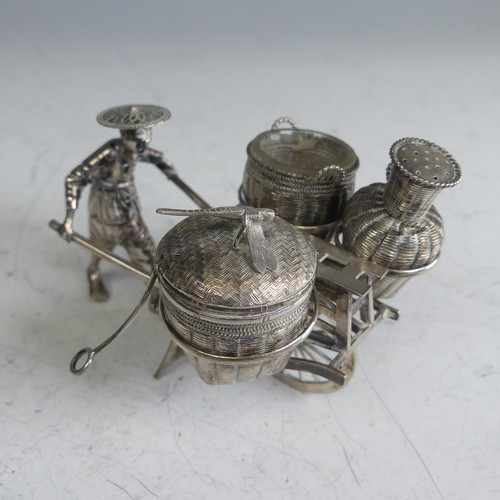 114 - A Chinese novelty silver Cruet, in the form of a richshaw, with mustard, open salt and pepper 'baske... 