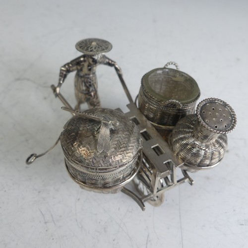 114 - A Chinese novelty silver Cruet, in the form of a richshaw, with mustard, open salt and pepper 'baske... 