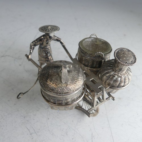 114 - A Chinese novelty silver Cruet, in the form of a richshaw, with mustard, open salt and pepper 'baske... 