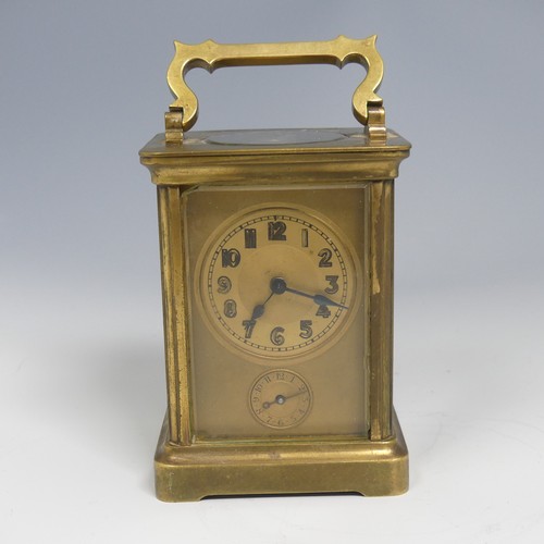 373 - An early 20th century French brass alarm carriage Clock, gilt arabic dial above subsidiary arabic al... 