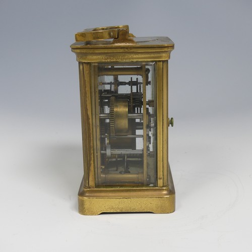 373 - An early 20th century French brass alarm carriage Clock, gilt arabic dial above subsidiary arabic al... 