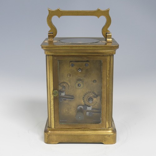 373 - An early 20th century French brass alarm carriage Clock, gilt arabic dial above subsidiary arabic al... 