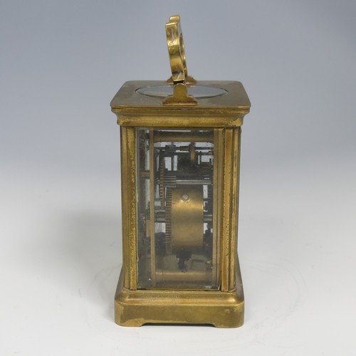 373 - An early 20th century French brass alarm carriage Clock, gilt arabic dial above subsidiary arabic al... 