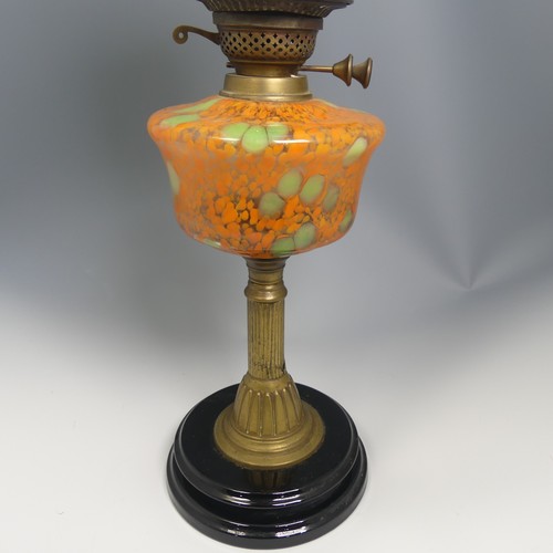 531 - An antique brass Oil Lamp, painted bohemian glass reservoir raised on brass base, stamped 'British M... 