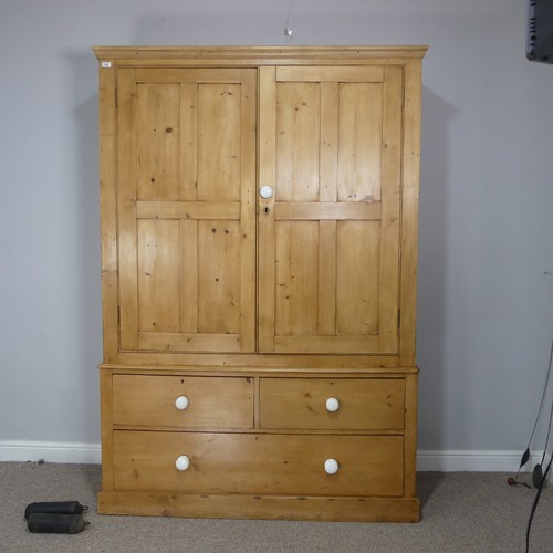 502 - A large Victorian pine Housekeepers Cupboard, later cornice above two large panelled cupboard doors ... 