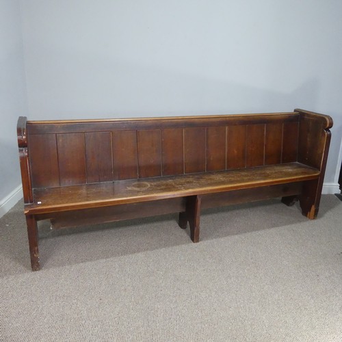 601 - A large antique oak Church Pew, with panelled back and reeded arm supports, W 214 cm x H 84 cm x D 5... 