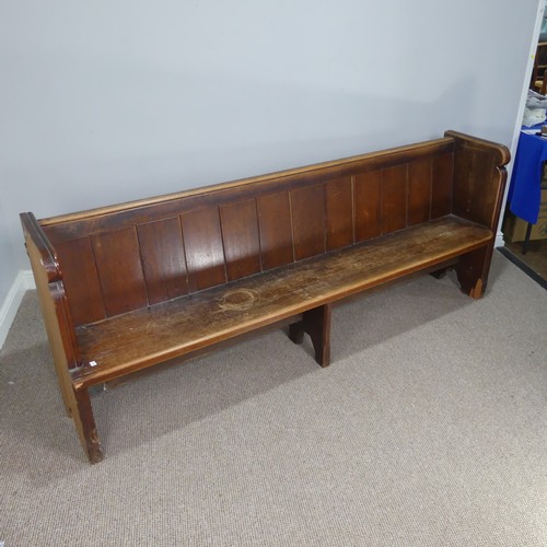 601 - A large antique oak Church Pew, with panelled back and reeded arm supports, W 214 cm x H 84 cm x D 5... 