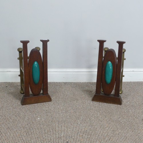 561 - A pair of Arts and Crafts oak and brass Andirons, inset with central cabochons, W 20 cm x H 41 cm x ... 