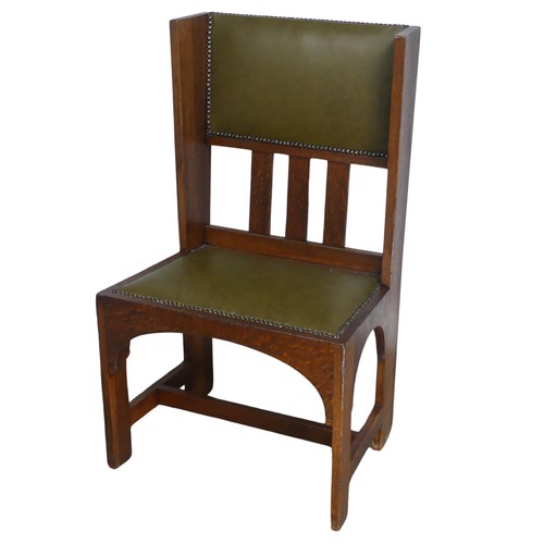 580 - An Arts and Crafts oak occasional Chair, attributed to Leonard Wyburd for Liberty & co, with uph... 