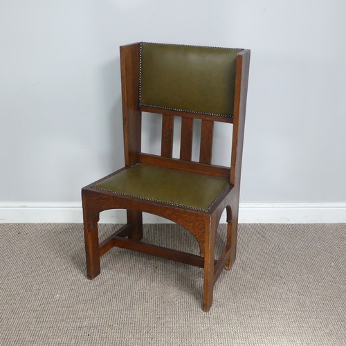 580 - An Arts and Crafts oak occasional Chair, attributed to Leonard Wyburd for Liberty & co, with uph... 