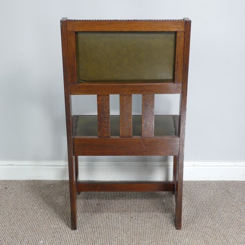 580 - An Arts and Crafts oak occasional Chair, attributed to Leonard Wyburd for Liberty & co, with uph... 