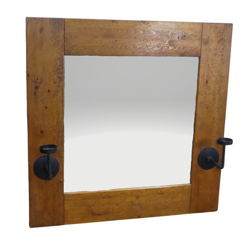 501 - An impressive craftsman-made oak framed Wall Mirror, with iron candle sconces, 122cm x 122cm.... 