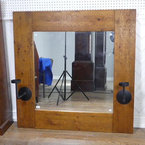 501 - An impressive craftsman-made oak framed Wall Mirror, with iron candle sconces, 122cm x 122cm.... 