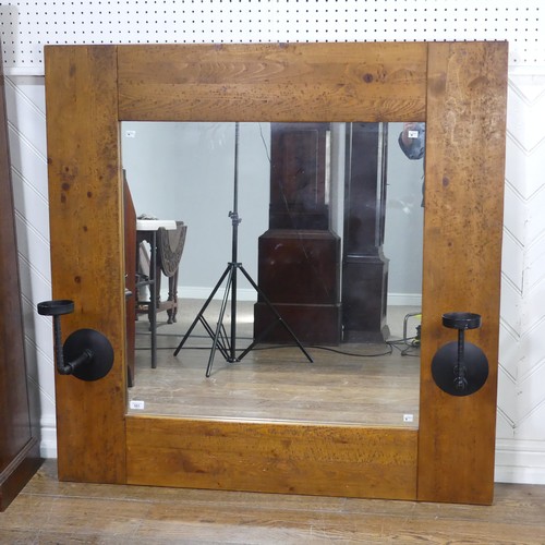 501 - An impressive craftsman-made oak framed Wall Mirror, with iron candle sconces, 122cm x 122cm.... 