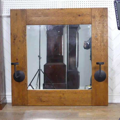 501 - An impressive craftsman-made oak framed Wall Mirror, with iron candle sconces, 122cm x 122cm.... 