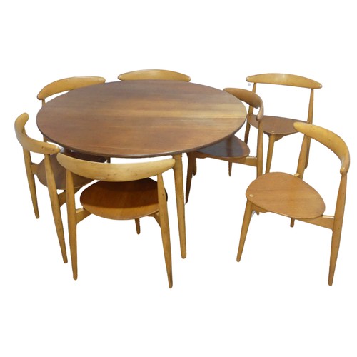 407 - Hans Wegner for Fritz Hansen ; A Danish teak and beech dining Table with seven 'heart' Chairs, the c... 