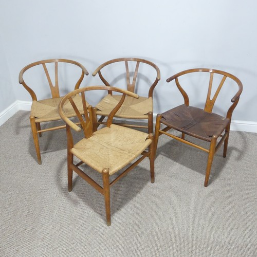 406 - Hans Wegner (Danish 1914-2007) for Carl Hansen & Son ; A set of four 'Wishbone Chairs / Y-Chairs... 