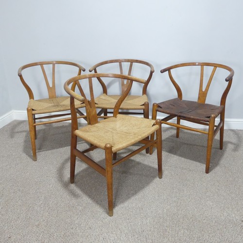 406 - Hans Wegner (Danish 1914-2007) for Carl Hansen & Son ; A set of four 'Wishbone Chairs / Y-Chairs... 