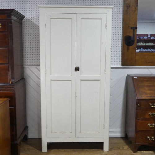 638 - An early 20th century painted pine housekeepers Cupboard, large panelled doors enclosing four deep s... 