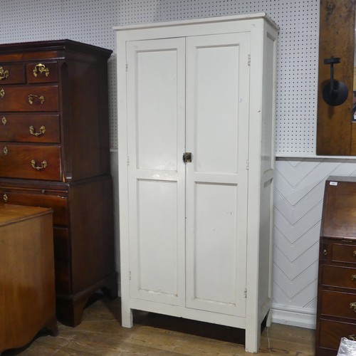 638 - An early 20th century painted pine housekeepers Cupboard, large panelled doors enclosing four deep s... 