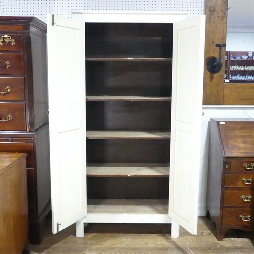 638 - An early 20th century painted pine housekeepers Cupboard, large panelled doors enclosing four deep s... 