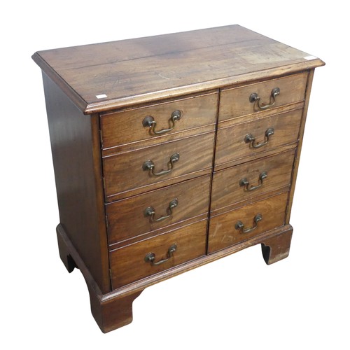 628 - A Georgian mahogany Bachelor's Chest, converted to cupboards, of small proportions, raised on bracke... 