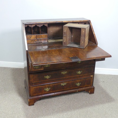 710 - A Georgian mahogany Bureau, sloped fall front with inlaid banding, concealing fitted interior above ... 