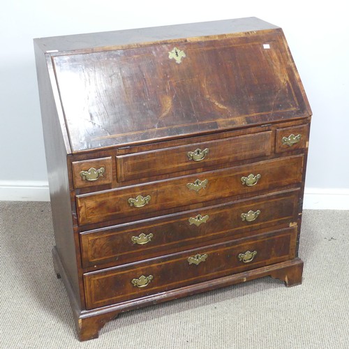 710 - A Georgian mahogany Bureau, sloped fall front with inlaid banding, concealing fitted interior above ... 