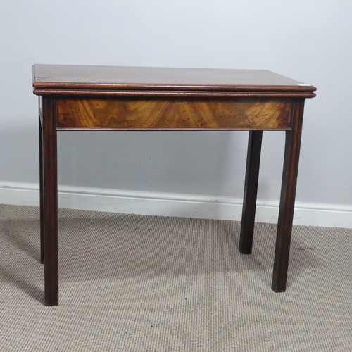 625 - A Georgian mahogany folding tea Table, rectangular top raised on four square and canted supports, on... 