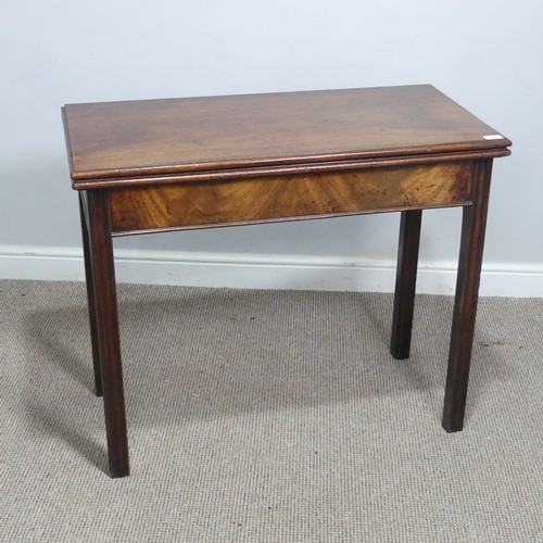 625 - A Georgian mahogany folding tea Table, rectangular top raised on four square and canted supports, on... 