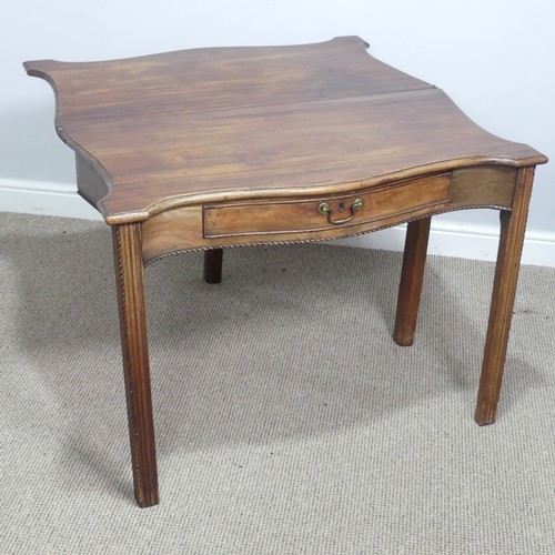 635 - A Georgian mahogany serpentine front folding Tea Table, moulded top raised on square reeded supports... 