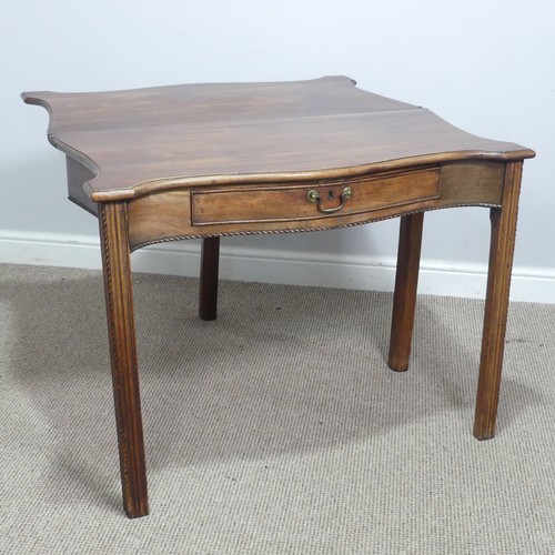 635 - A Georgian mahogany serpentine front folding Tea Table, moulded top raised on square reeded supports... 