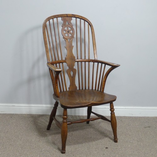 637 - An antique ash and elm windsor Armchair, hoop stick and splat back above squashed pad arms, above sh... 