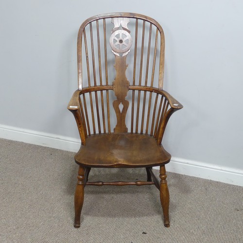 637 - An antique ash and elm windsor Armchair, hoop stick and splat back above squashed pad arms, above sh... 